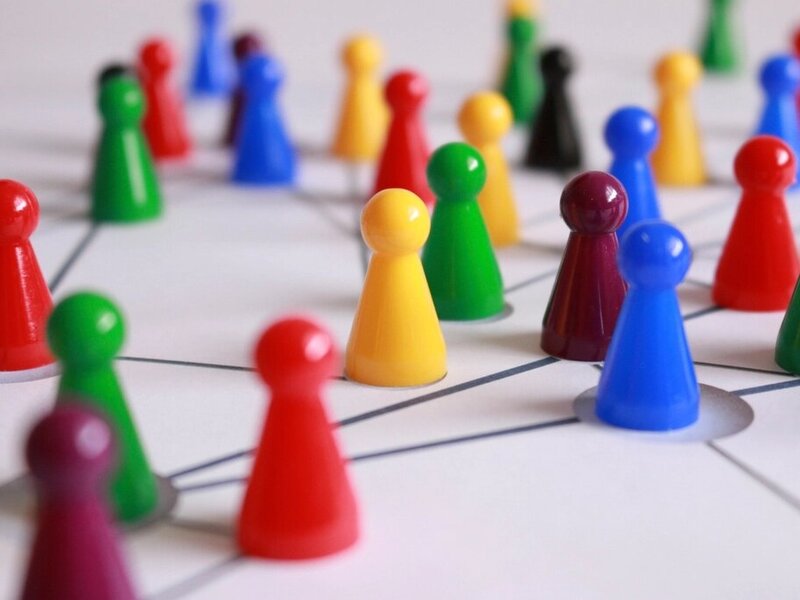 Colourful tabletop game pieces illustrating shared play
