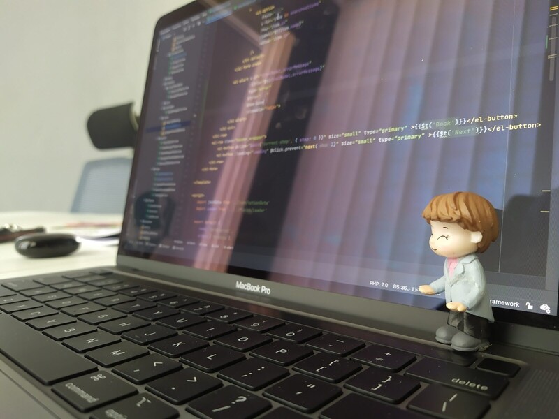 A laptop displaying programming code